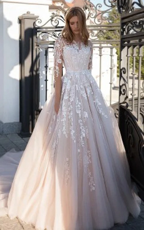 Vestido de novia etéreo de corte A, largo hasta el suelo, de manga larga, de tul con apliques.